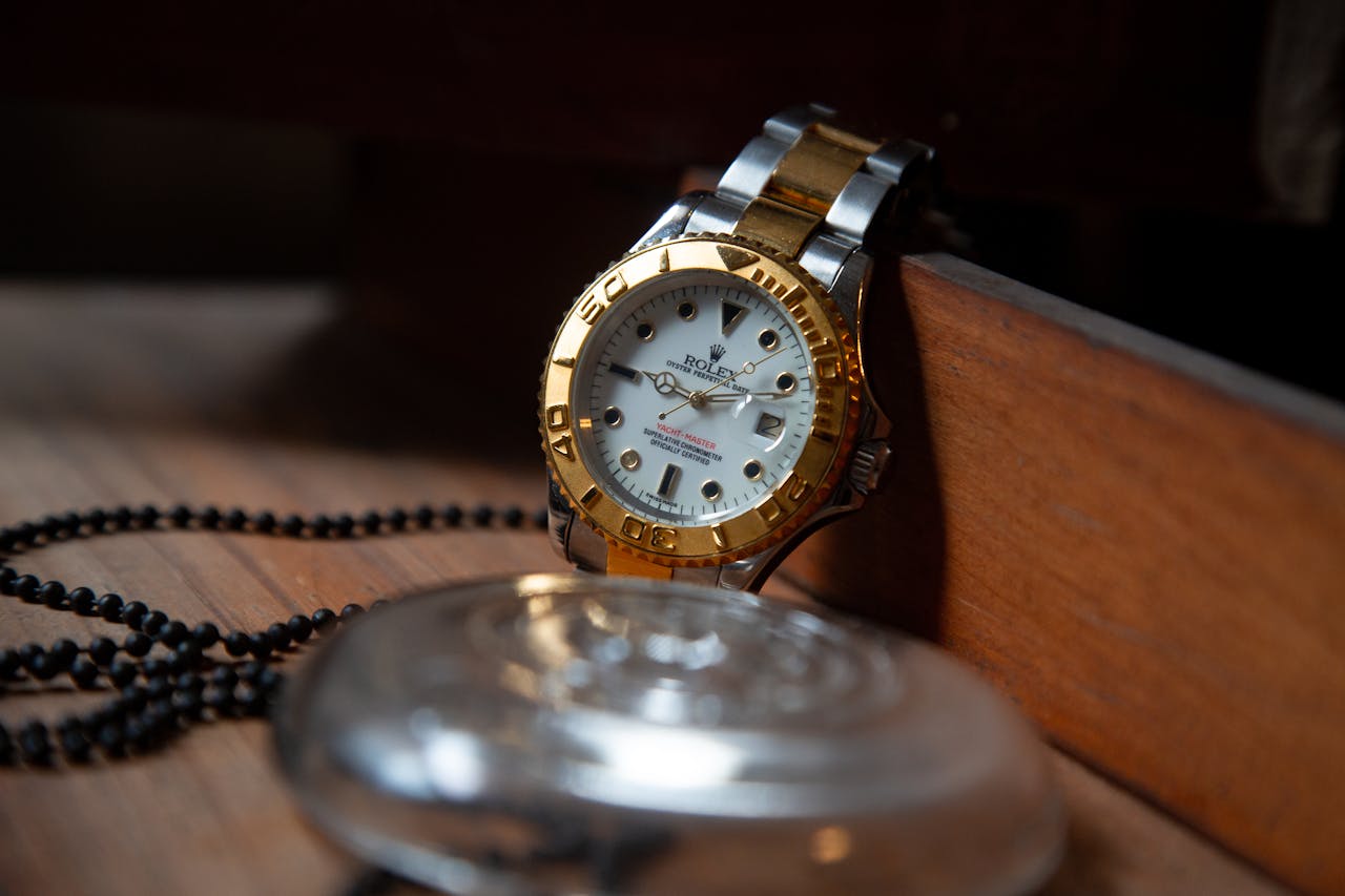 About Close-up of a luxury Rolex wristwatch with gold and silver detailing, symbolizing elegance and precision.